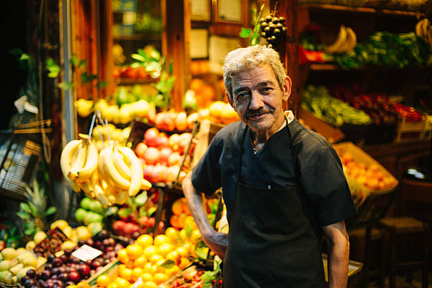 Market Vendor Fruit Shop Owner in front of his shop. Istanbul, Turkey. turkish culture stock pictures, royalty-free photos & images