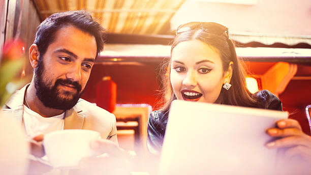 istock Happy couple surfing with digital tablet 530743839