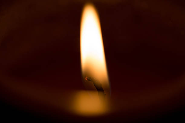 istock closeup macro of light on candle 530743879
