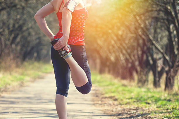 Sport woman jogging outside in morning stock photo