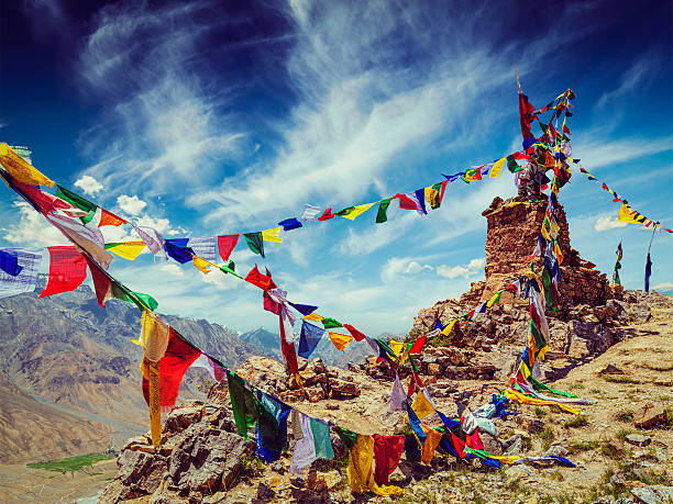 Buddhist prayer flags in Himalayas Vintage retro effect filtered hipster style image of Buddhist prayer flags (lungta) in Spiti Valley, Himachal Pradesh, India tibet culture stock pictures, royalty-free photos & images