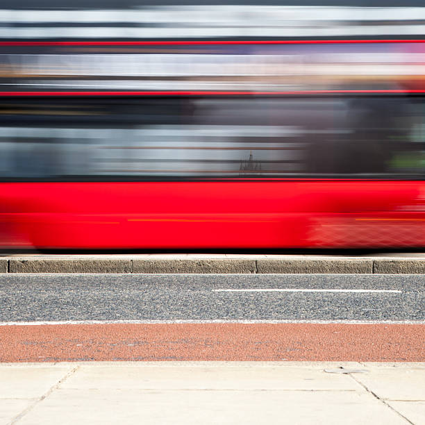 istock rush hour: Red London bus abstract background 530744550