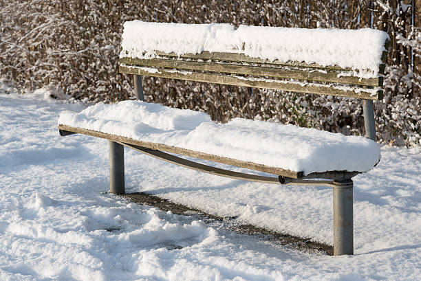 Snowcovered bench. Imprint from guest stock photo