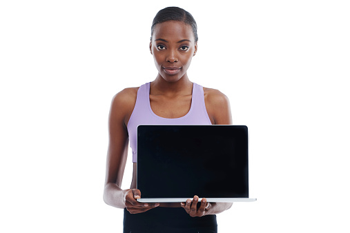 A portrait of a sporty woman holding a laptop with a blank screenhttp://195.154.178.81/DATA/shoots/ic_783850.jpg