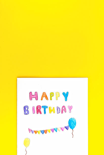 istock Happy birthday card kid handwriting on yellow background 530745774
