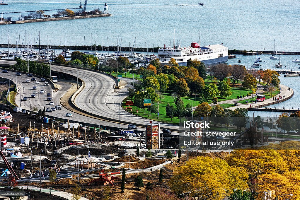 Maggie Daley Park under construction and Columbia Yacht Club, Ch Chicago, USA - October 19, 2014: Maggie Daley Park under construction in The Loop, downtown Chicago. Viewed from above in Autumn.  Lakeshore Drive, Lake Michigan, and Columbia Yacht Club in the background. Distant people. Chicago - Illinois Stock Photo