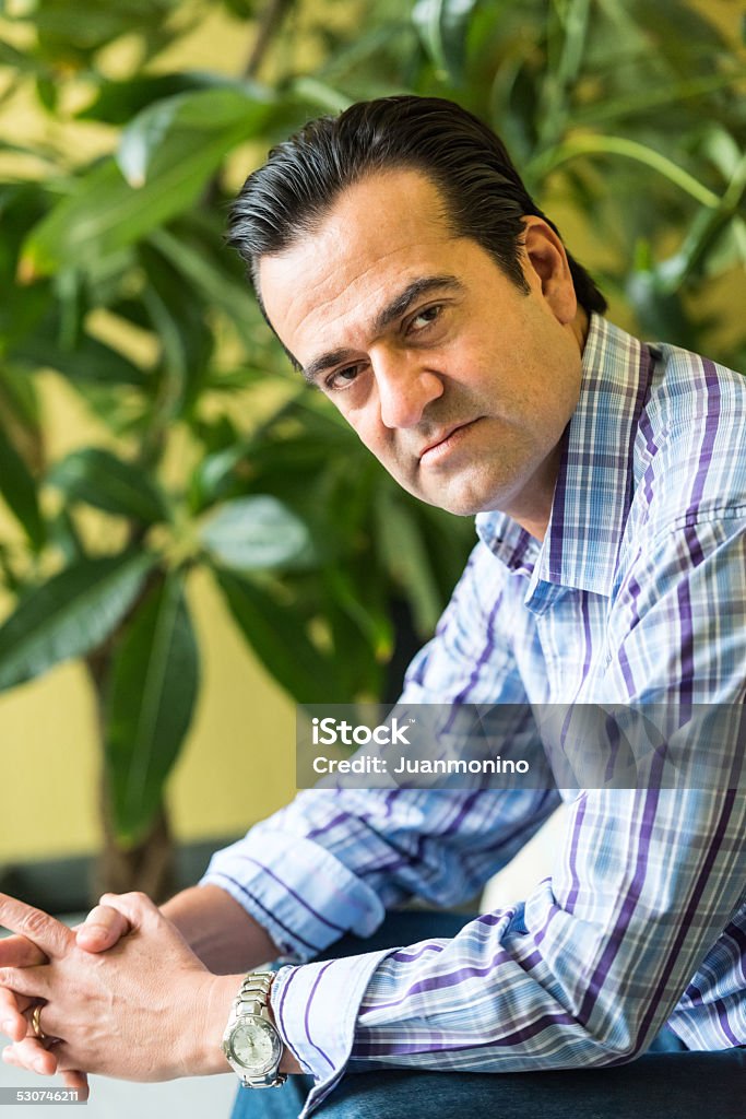 Forty something man Forty something Hispanic man posing looking at the camera 2015 Stock Photo