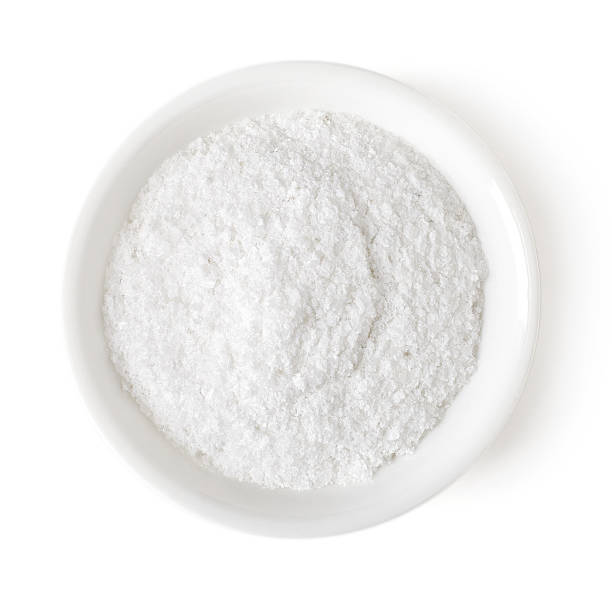 istock Bowl of table salt on white background, top view 530747458