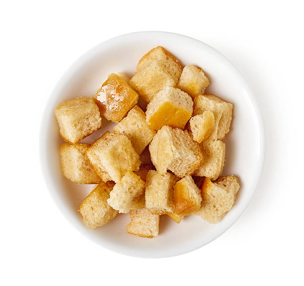 istock Bowl of croutons isolated on white, top view 530748102