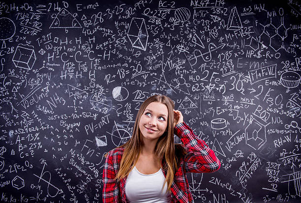 istock Student against a big blackboard with mathematical symbols 530748796