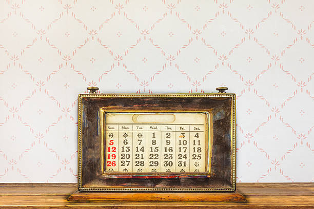istock Vintage desktop calendar on a wooden table 530748954