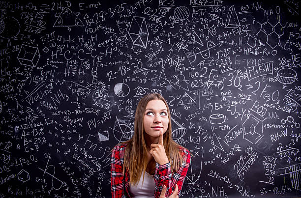 istock Student against a big blackboard with mathematical symbols 530748986