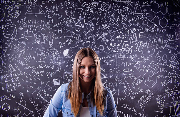 istock Student against a big blackboard with mathematical symbols 530749514