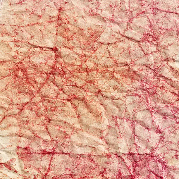 Crumpled paper sheet with watercolor stains. Wrapping-paper texture. Phototexture for your design.
