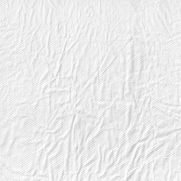 istock Perforated crumpled fluffy white paper photo texture. 530749774