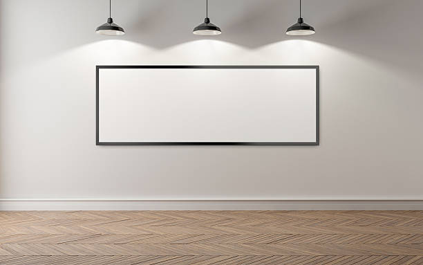 istock An empty room with blank picture frame and 3 lamps 530749778