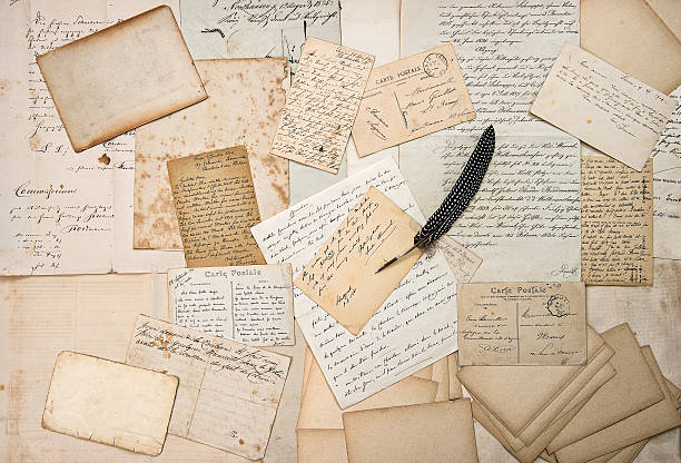 istock letters, handwritings, vintage postcards and feather pen 530755091