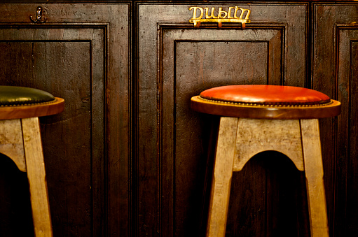 Dublin metal hangers in the bar of a pub with stools