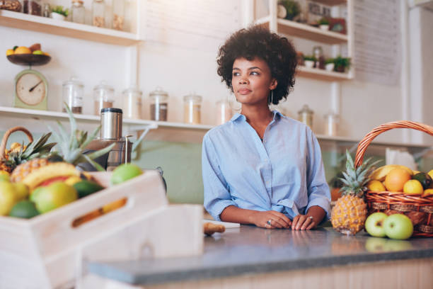 istock Confident young female juice bar employee 530755628