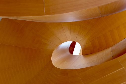 Wood abstract of a constructed staircase put together piece by piece