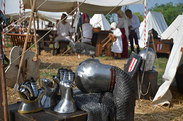 medieval camp with armor - uitbeenhandschoen stockfoto's en -beelden