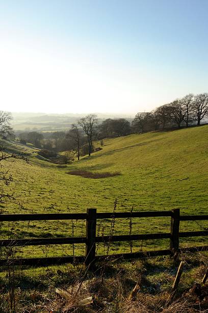 istock fence leading to countryside 530758197