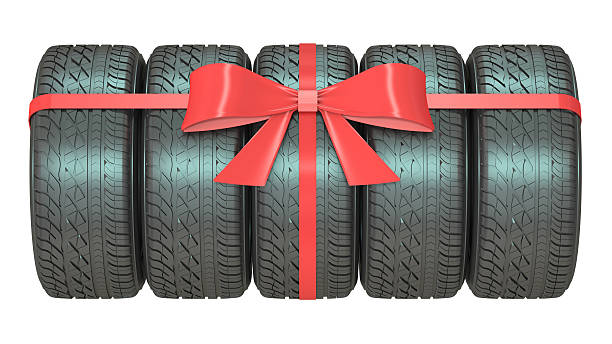 istock Gift set of tires wrapped ribbon and bow, 3D rendering 530758238