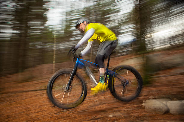 istock Mountain biker descending a trail at speed in Massachusetts 530758570