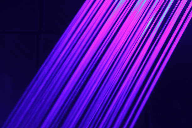 istock Illuminated running water in blue and pink lights 530758736
