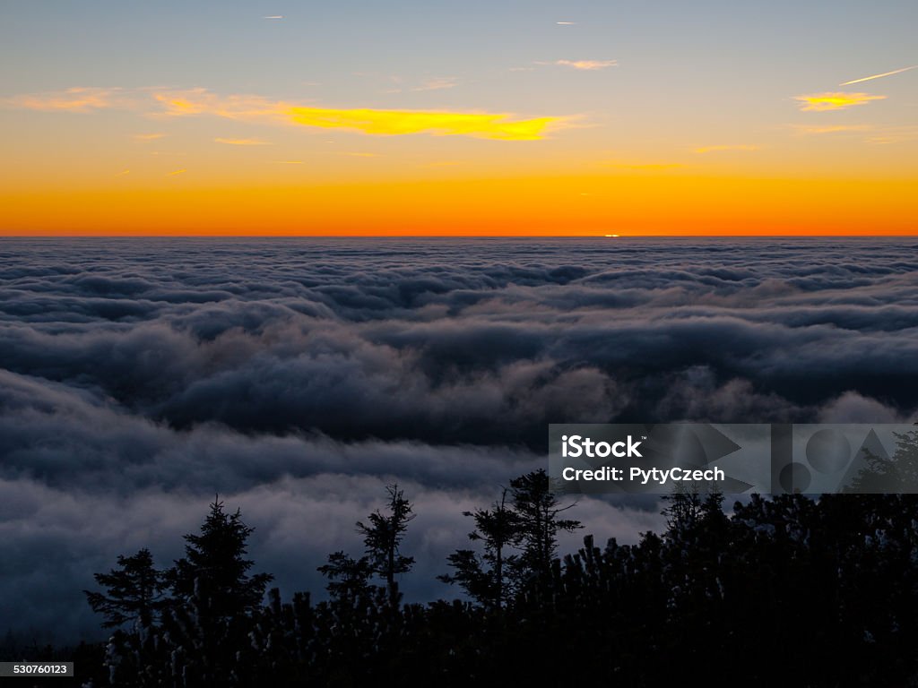 Winter inversion Winter inversion clouds in the mounains at sunset time Above Stock Photo