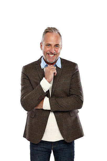 istock Happy mature man standing against white 530760179