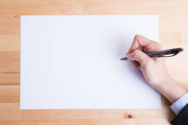 istock Business people writing on paper 530760364