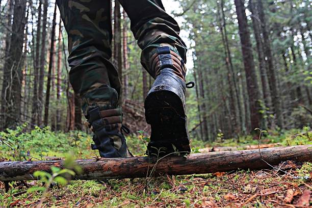 istock feet in shoes autumn forest hike 530760653
