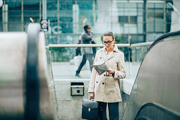 istock Businesswoman on an escalator 530761658