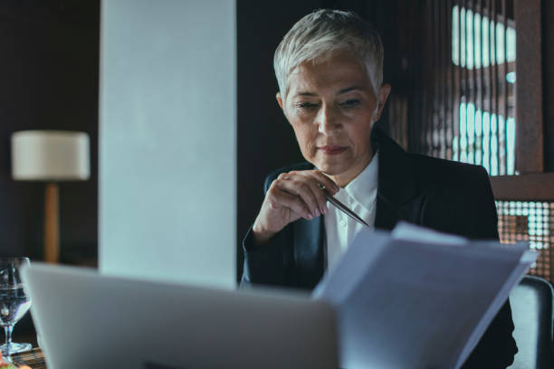 istock Mature Businesswoman Examining Documents. 530761884