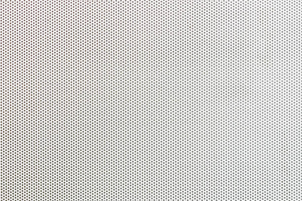 istock White metal plate with many small holes. 530764302
