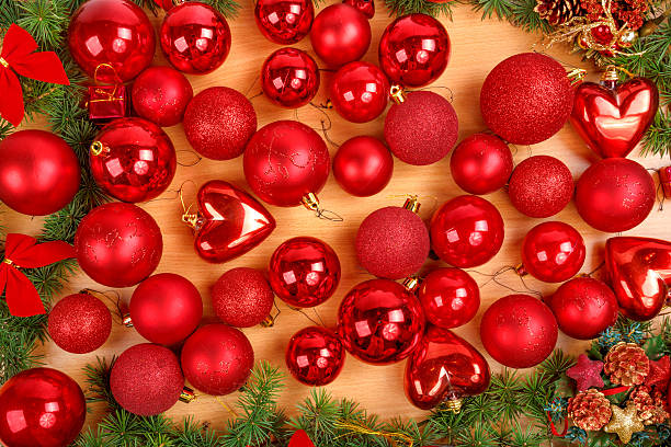 istock Christmas decoration with many scattered red round ornaments 530764925