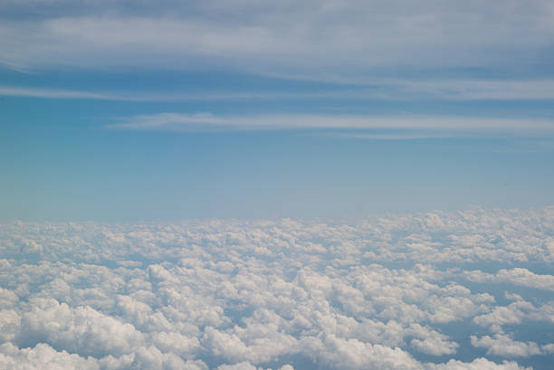 istock Clouds and sky as seen through window of an aircraft 530765254
