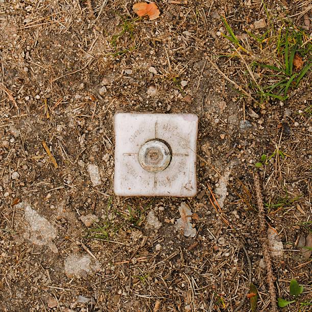 istock Border marker separating land plots 530765516