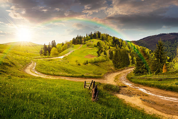 istock cross road on hillside meadow in mountain at sunset 530765669