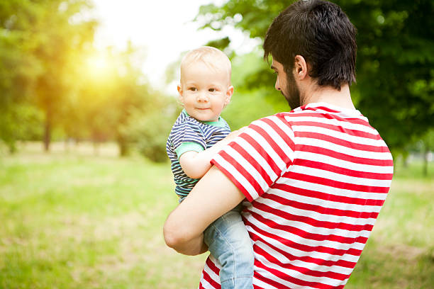 istock Father and son in meadow 530766008