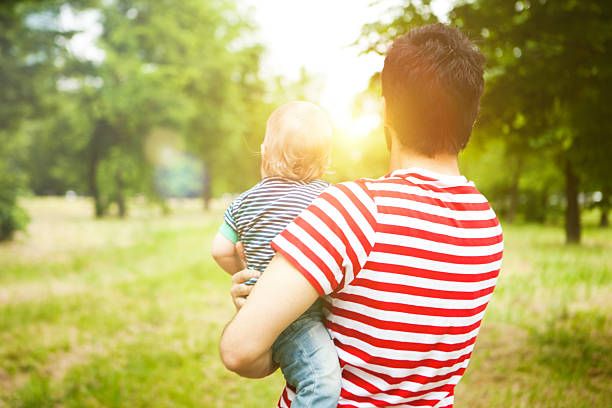 istock Father and son in meadow 530766108