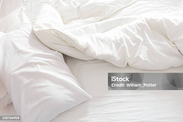 Top View Of An Unmade Bed With Crumpled Bed Sheet Stock Photo - Download Image Now - Bed - Furniture, Sheet - Bedding, White Color