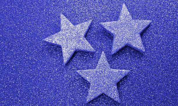 istock three large stars on bright red background illuminated 530767022