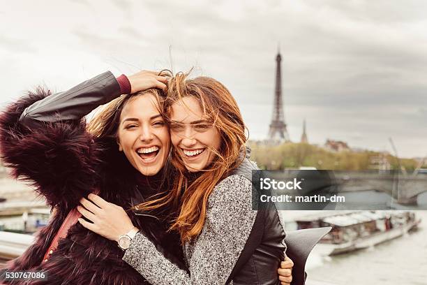 Happy Girls In Paris Against The Eiffel Tower Stock Photo - Download Image Now - Friendship, Paris - France, Teenage Girls