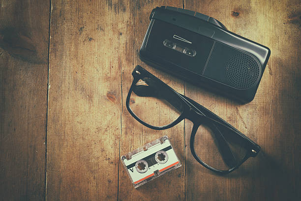 istock investigation concept. tape recorder, cassete and glasses 530767970