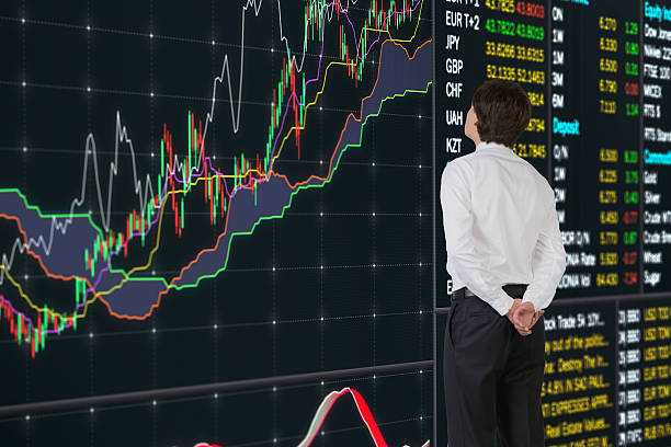 istock businessman looking on stock diagram 530769535