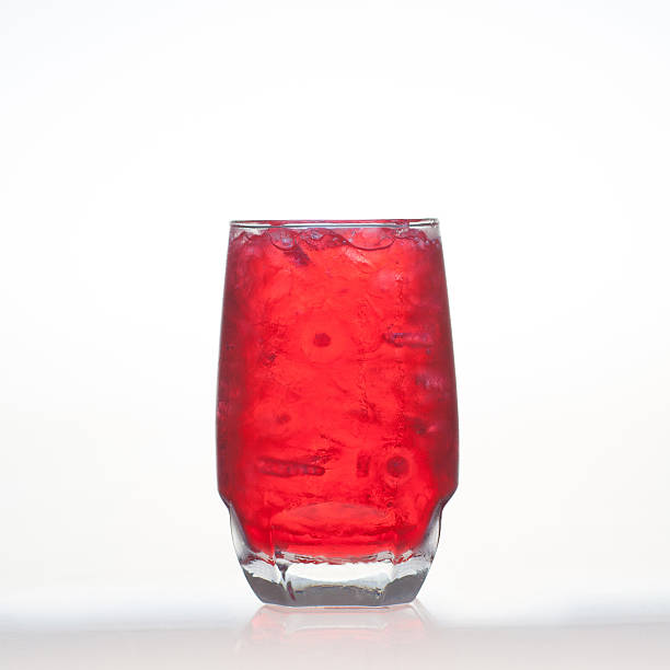 istock Red fruit flavor soft drinks whit soda water isolated 530771669