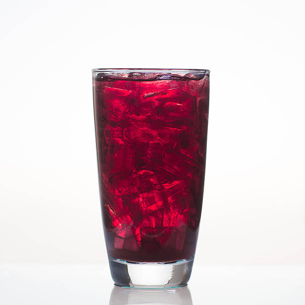 istock Sweet grape juice with ice in glass isolated 530776705