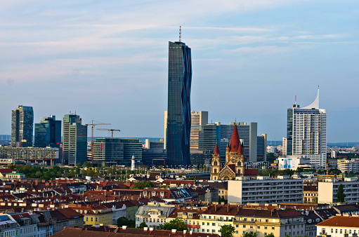 Vienna skyline at sunset, contrast between modern skycrapers and old style buildings, Austria